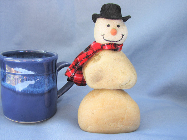 Snowman made of Stacked Stone - With Black Hat and Plaid Scarf