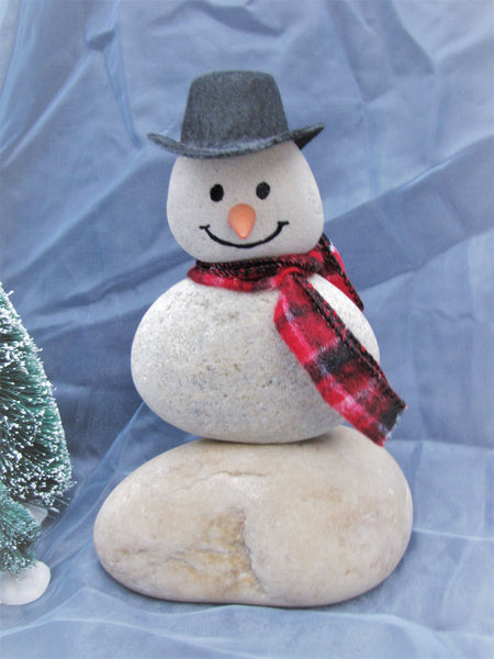 Snowman made of Stacked Stone - With Black Hat and Plaid Scarf